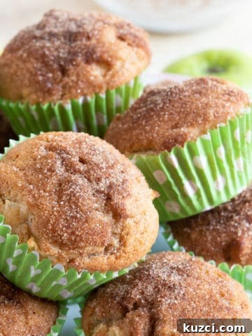 Easy cinnamon apple muffins on a cake stand.
