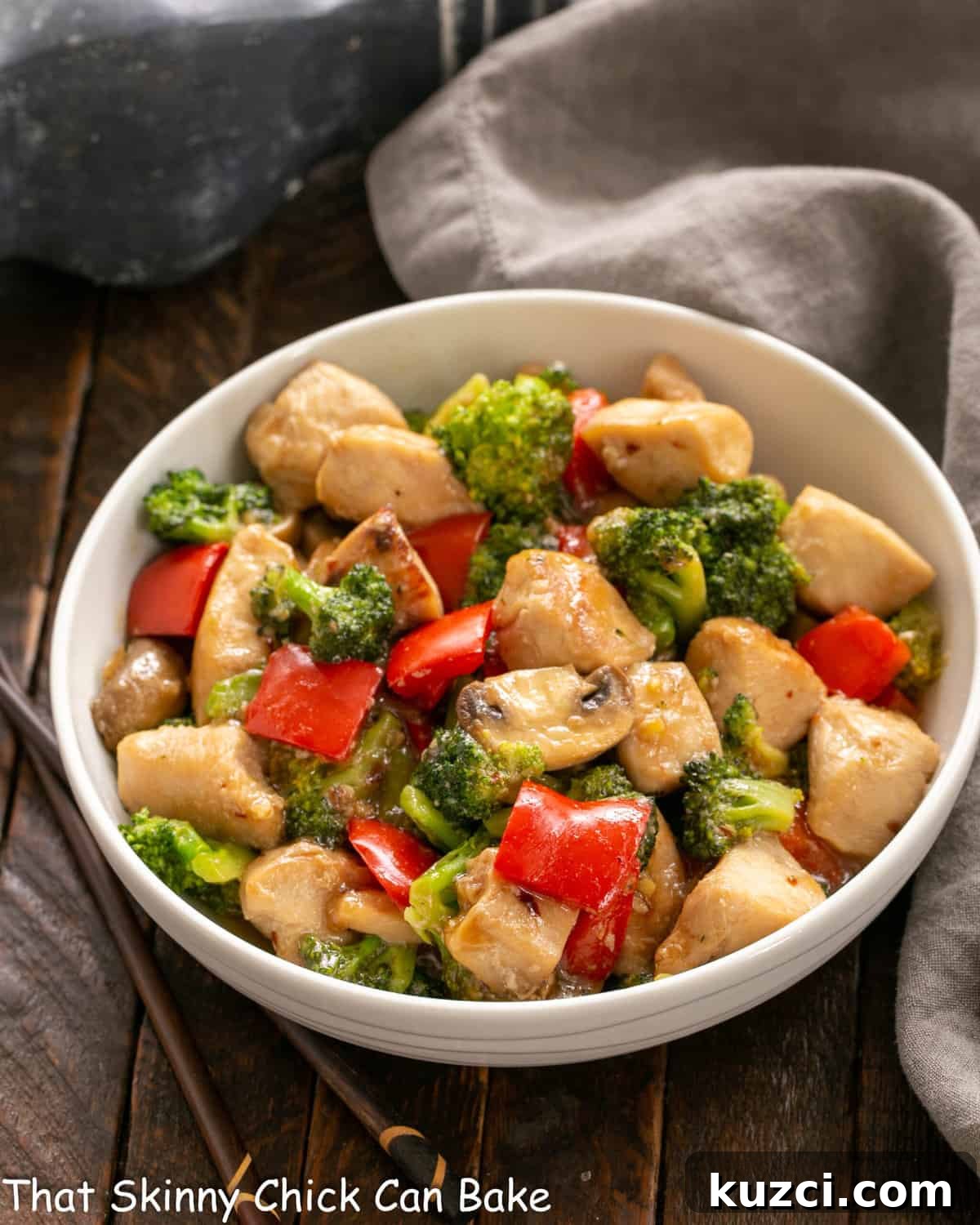 Chicken, Broccoli and Bell Pepper Stir Fry - an easy, flavorful dinner recipe that's family friendly and delicious! Chicken Broccoli Stir Fry in a white ceramic serving bowl.