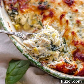 A spoonful of hot crab spinach artichoke dip.