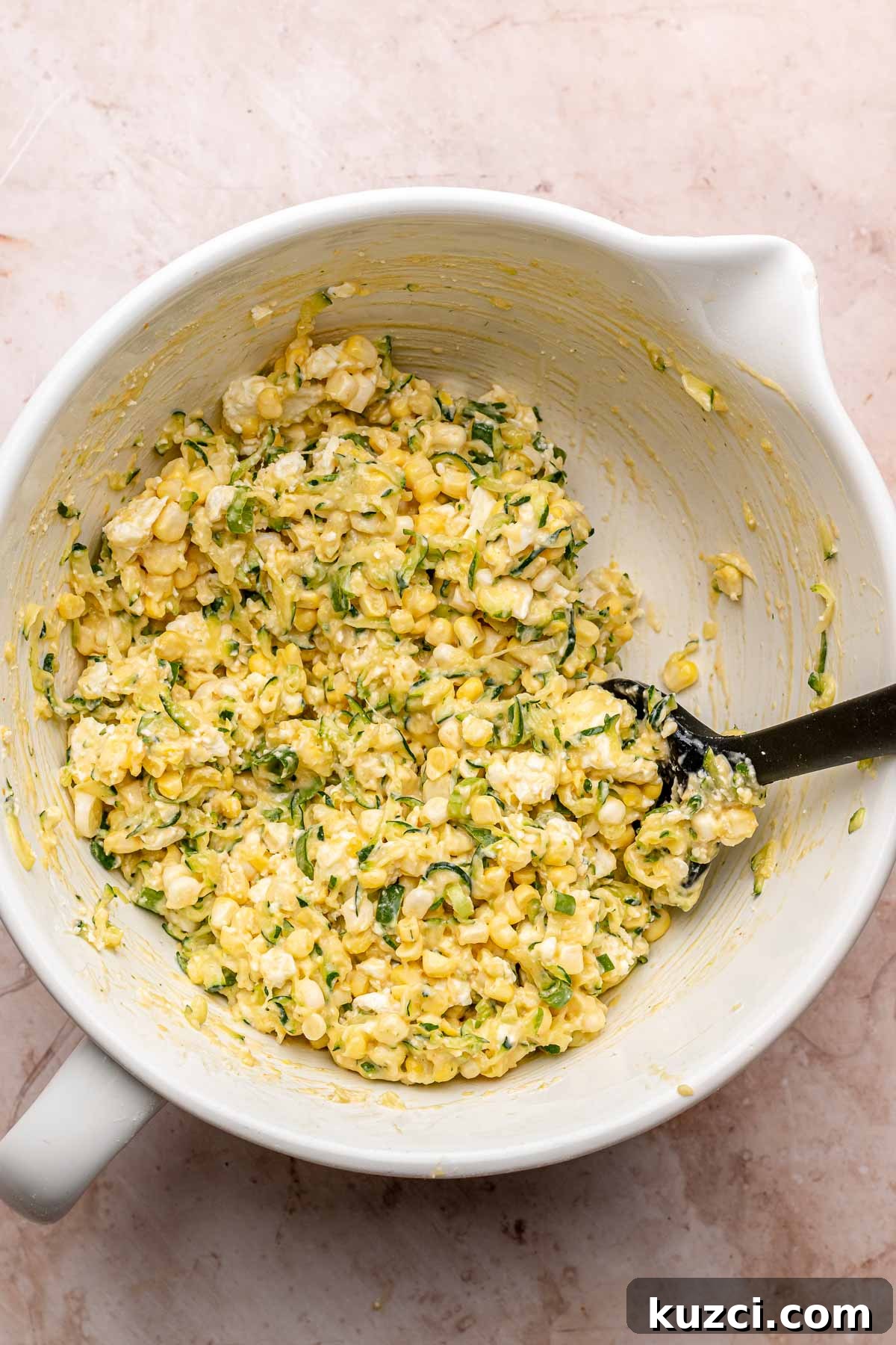 Crispy Corn and Zucchini Fritters with Herbed Yogurt Sauce 9 Corn and zucchini fritter batter in a bowl.