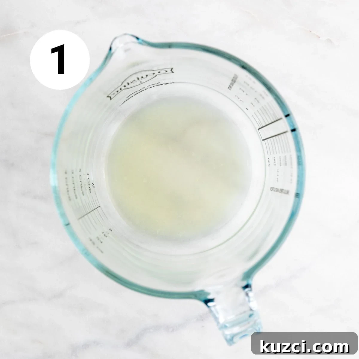 Measuring jar with lemon juice.