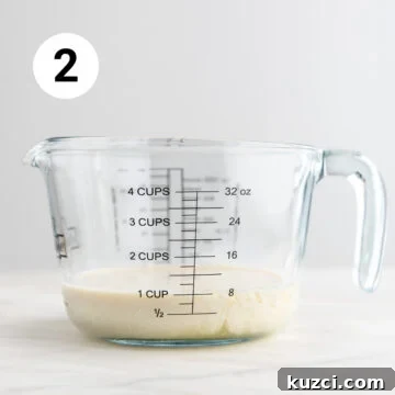 Measuring jar with vegan buttermilk.