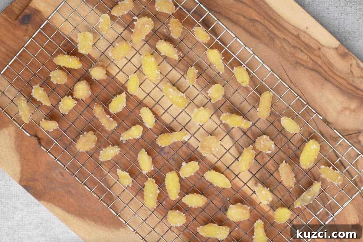 Homemade Crystallized Ginger Candy 14 Ginger candy drying on a cooling rack.