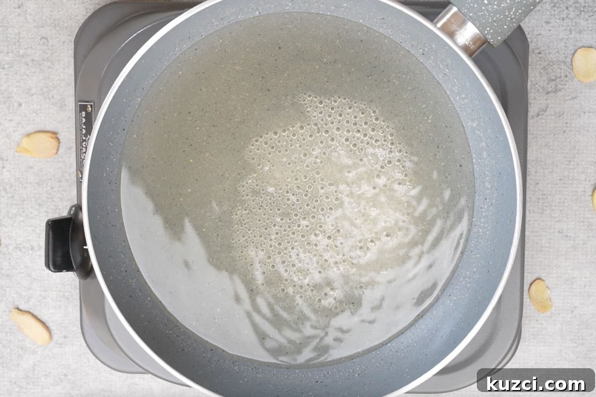 Homemade Crystallized Ginger Candy 8 Sugar syrup in the pan.