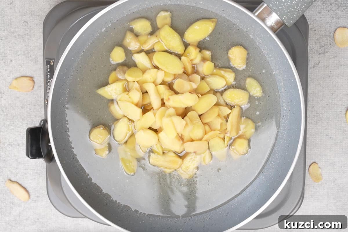 Homemade Crystallized Ginger Candy 9 Cooked ginger added to the pan.