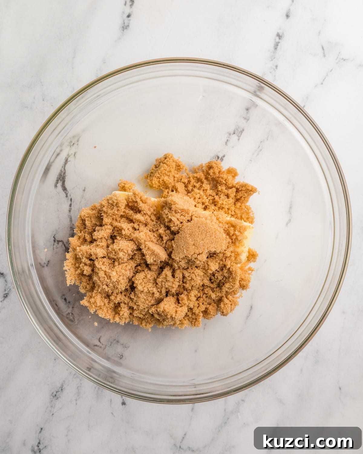 butter, sugar, and brown sugar in a bowl. 