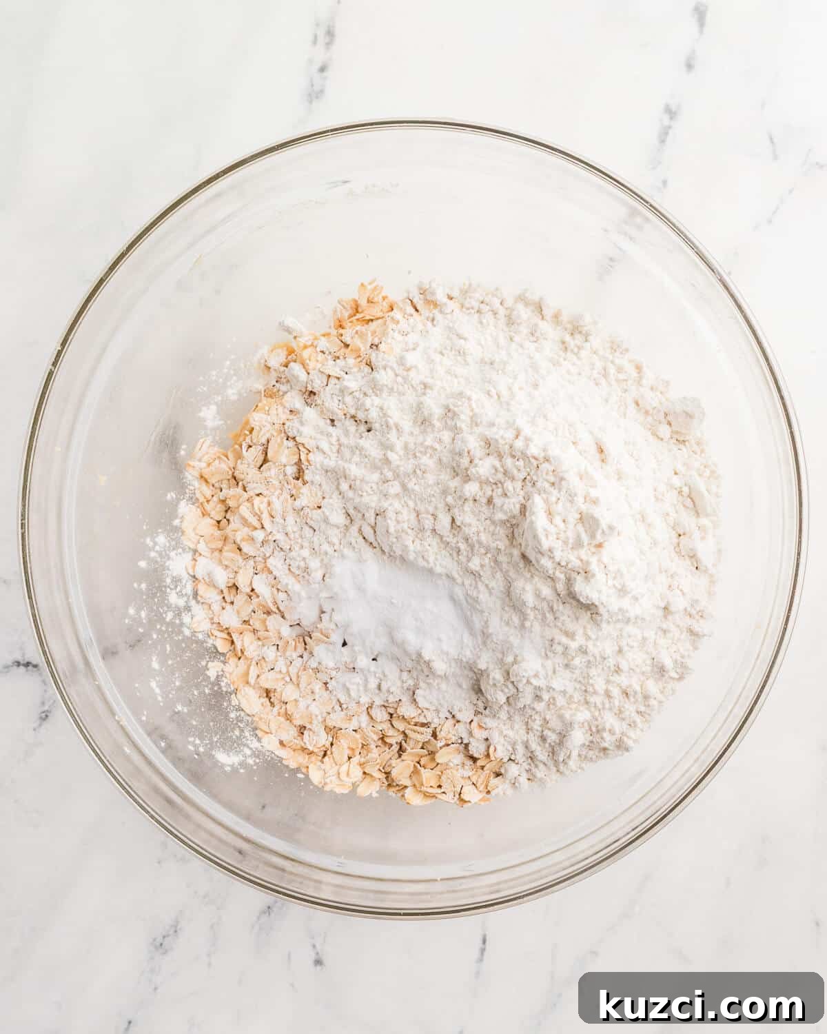 gluten-free flour, oats, and baking soda in a bowl. 