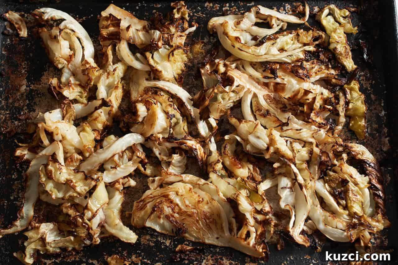 Charred Sheet Pan Cabbage with Tahini Sauce 5 Charred roasted cabbage on a sheet pan.