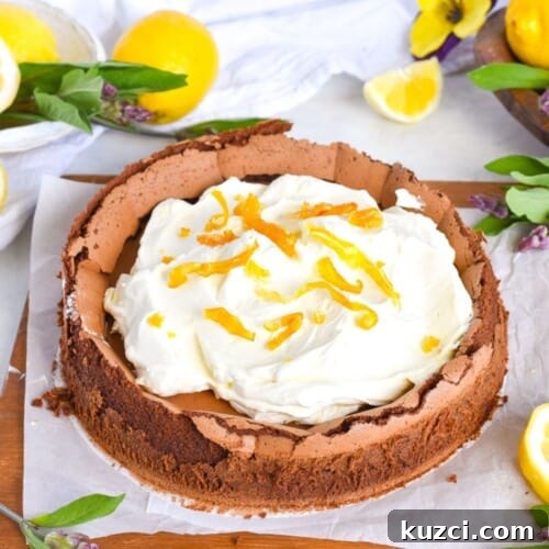 chocolate cake with cream on top on wooden board.