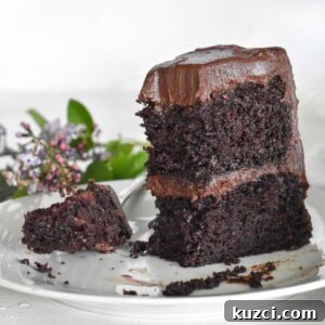 upright slice of cake with bite out of it.