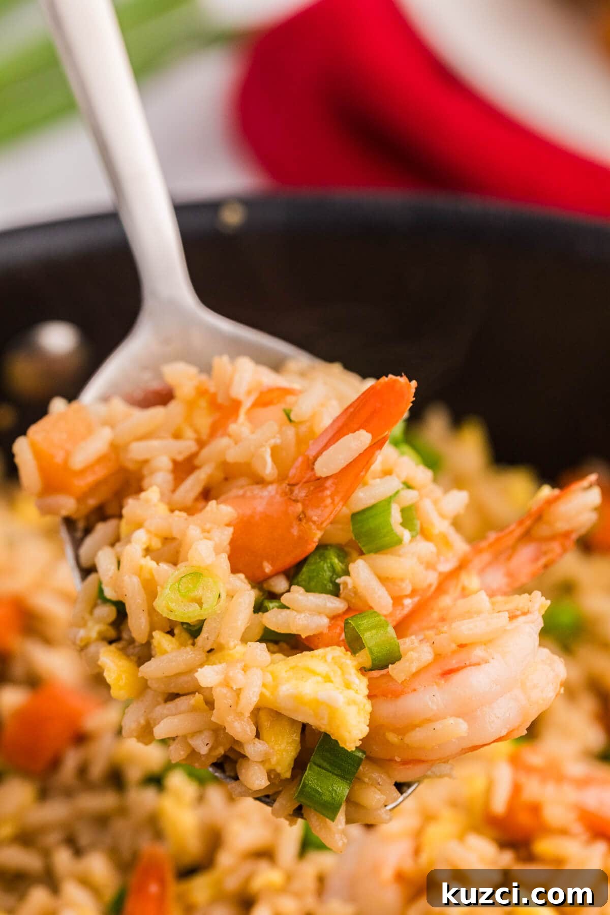 Garlic Shrimp Fried Rice Recipe with Egg and Vegetables 6 The recipe on a serving spoon.