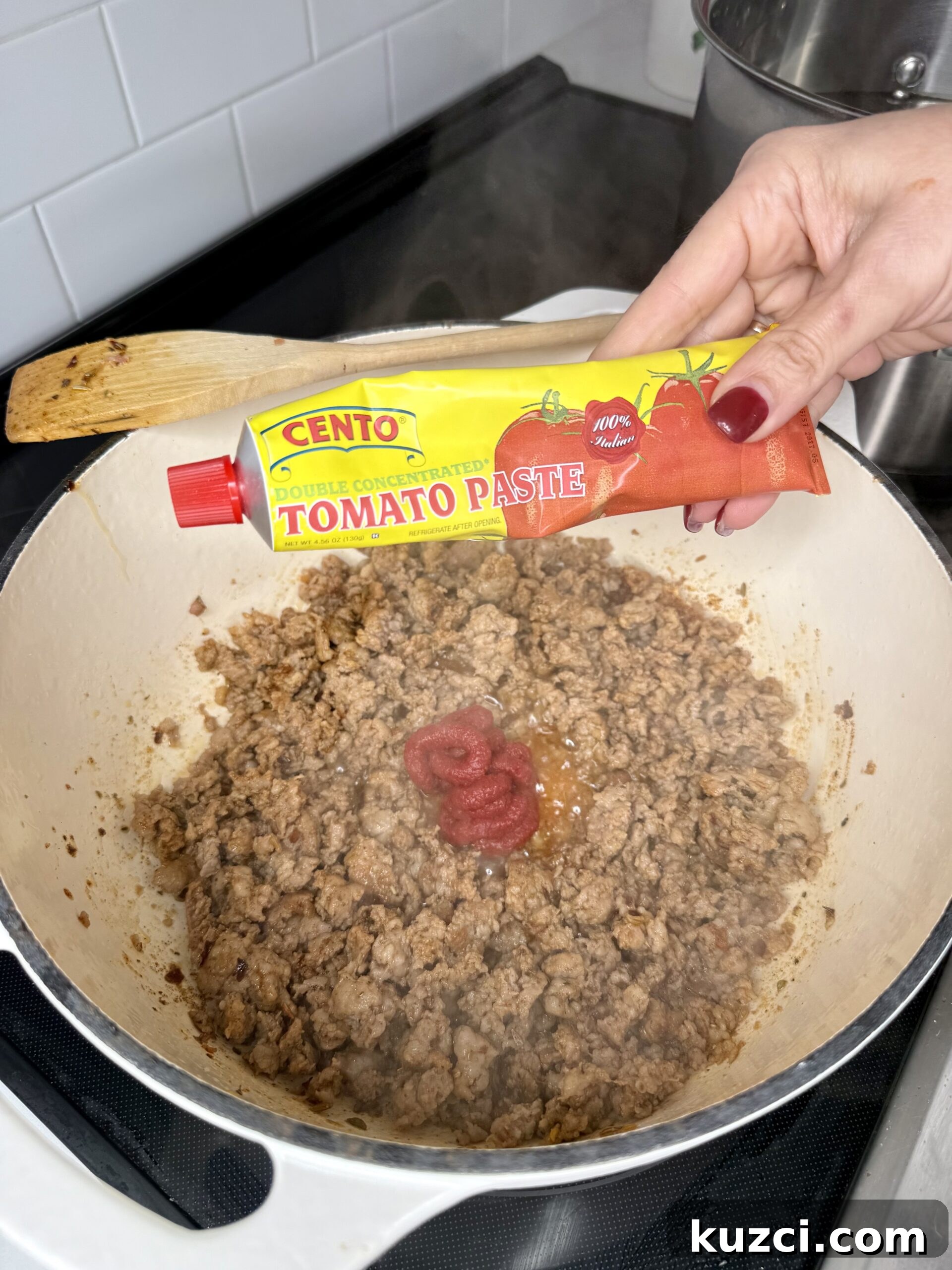 Creamy Sausage and Peppers Fettuccine 12 Adding vegetables to sausage sauce