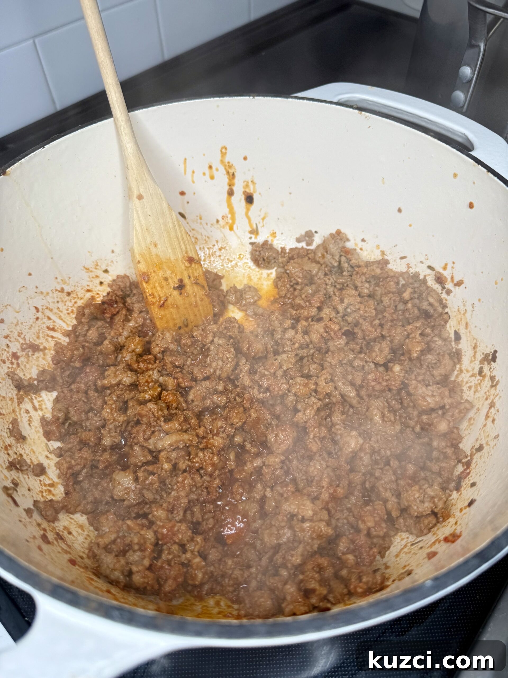 Creamy Sausage and Peppers Fettuccine 13 Sausage peppers onions and garlic cooking