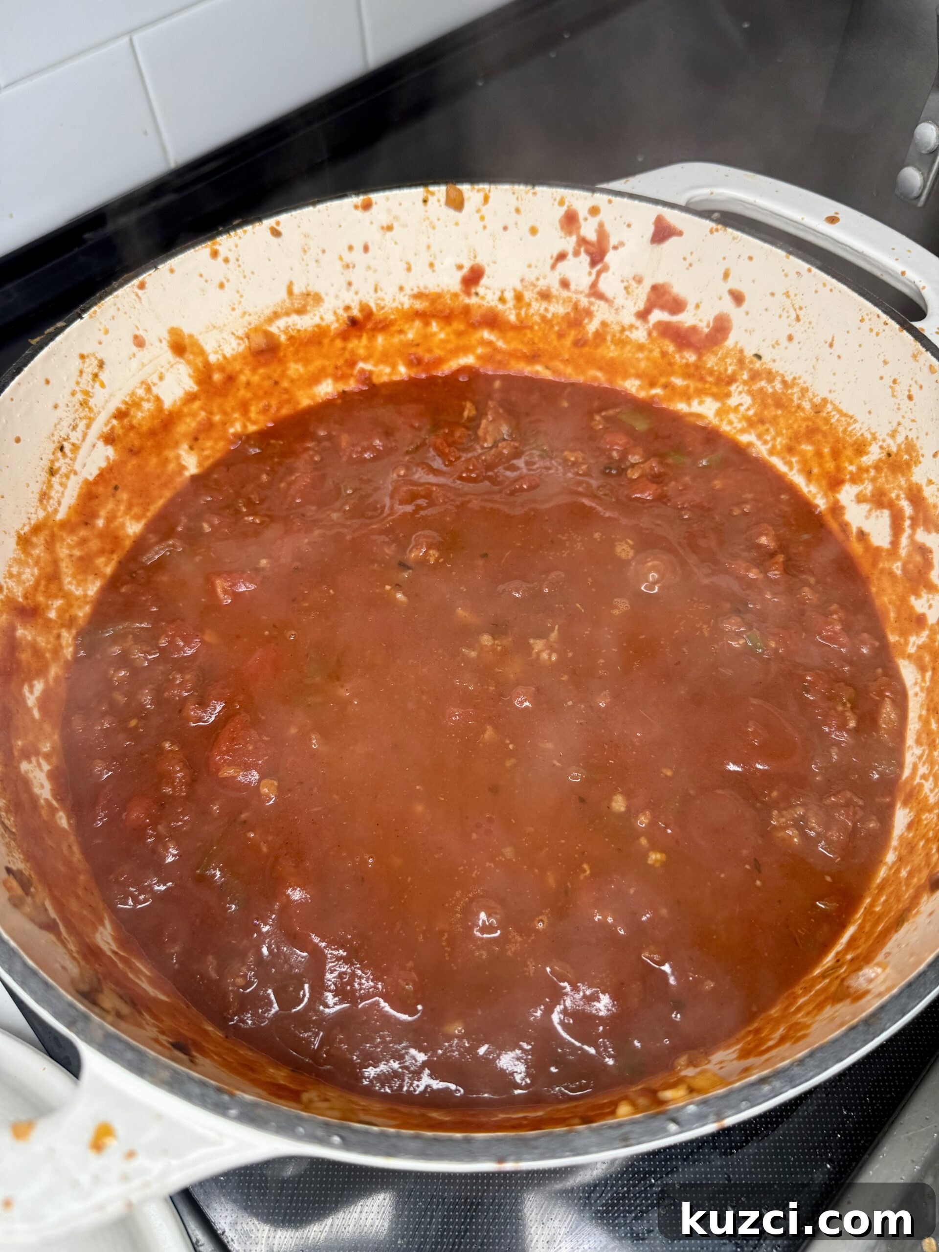 Creamy Sausage and Peppers Fettuccine 22 Creamy sausage and peppers sauce simmering