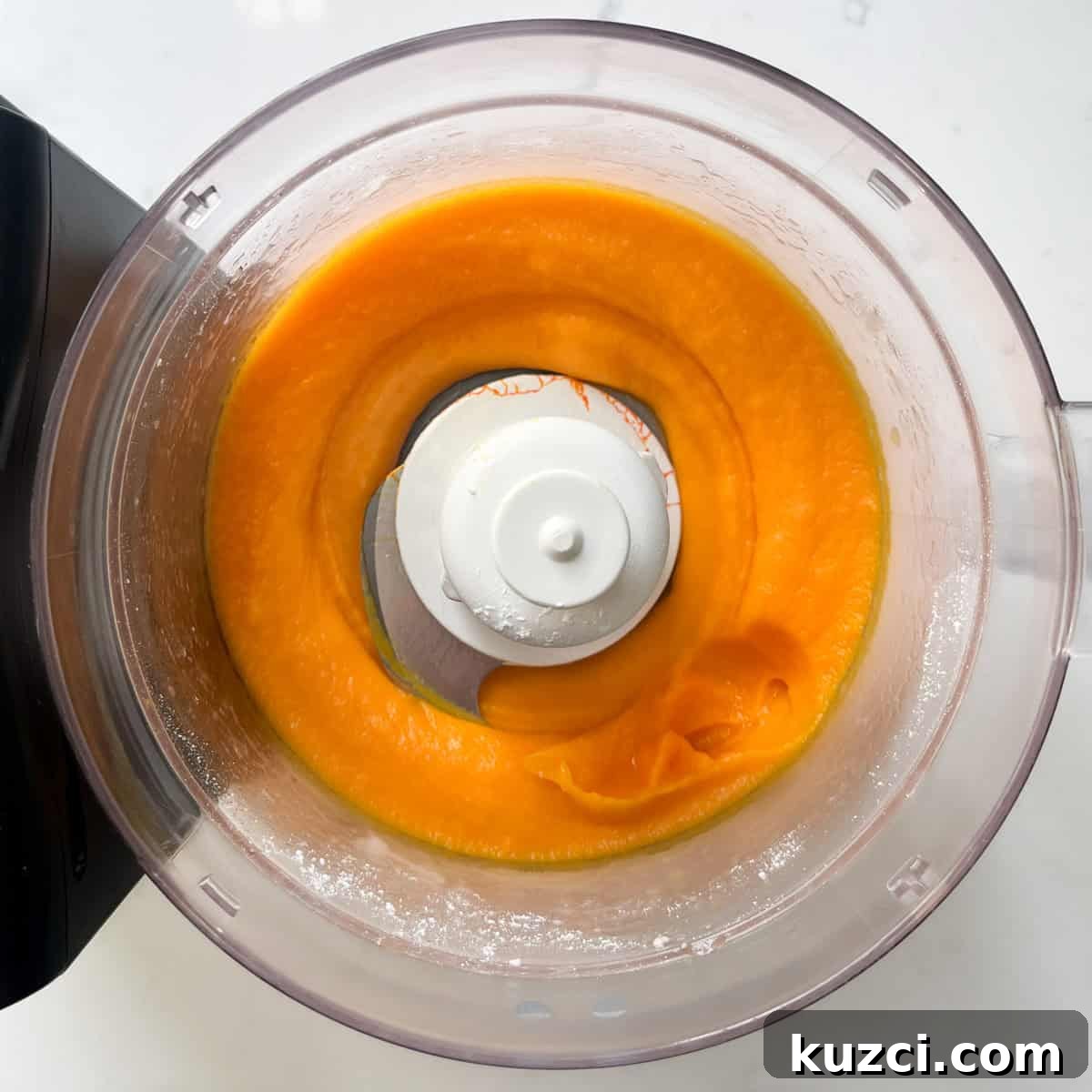 Creamy Mango Mousse Recipe 5 Pureeing the mango in the food processor for the mango mousse.