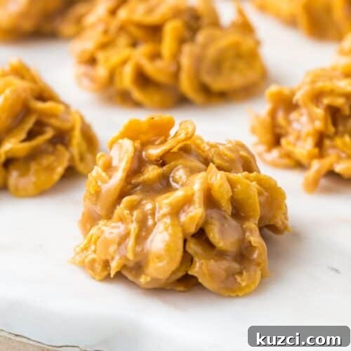 corn flake candy clusters on a white marble tray.