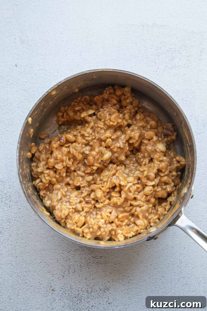 peanut butter mixture with peanuts and rice krispies.