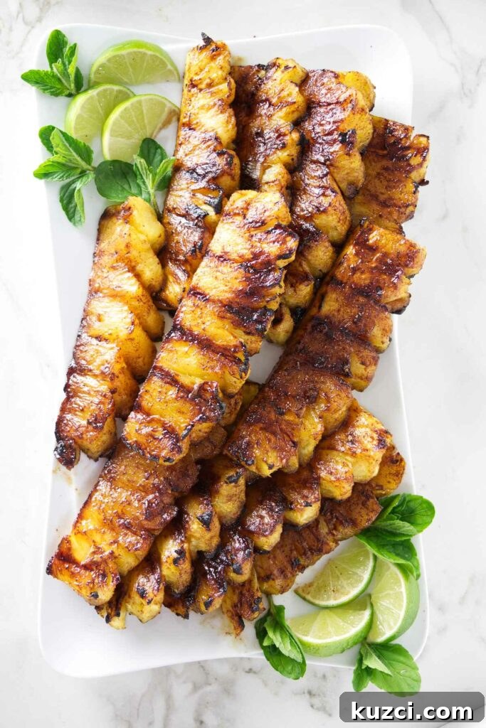 Cinnamon Sugar Grilled Pineapple Recipe 2 A serving platter with slices of cinnamon grilled pineapple.