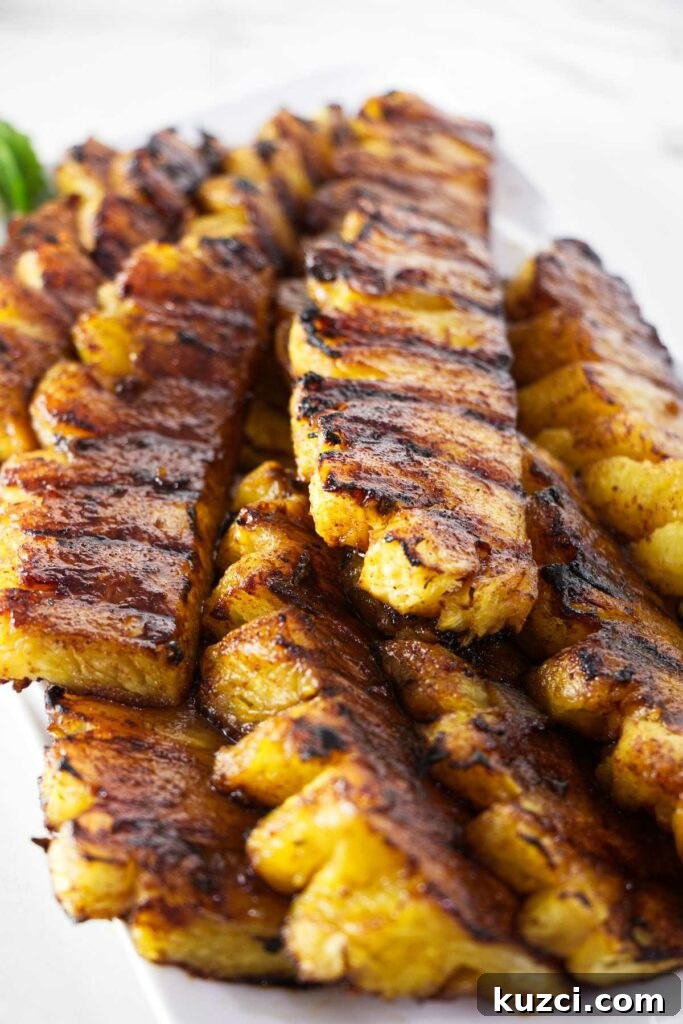 Cinnamon Sugar Grilled Pineapple Recipe 3 Several slices of grilled pineapple with cinnamon sugar.