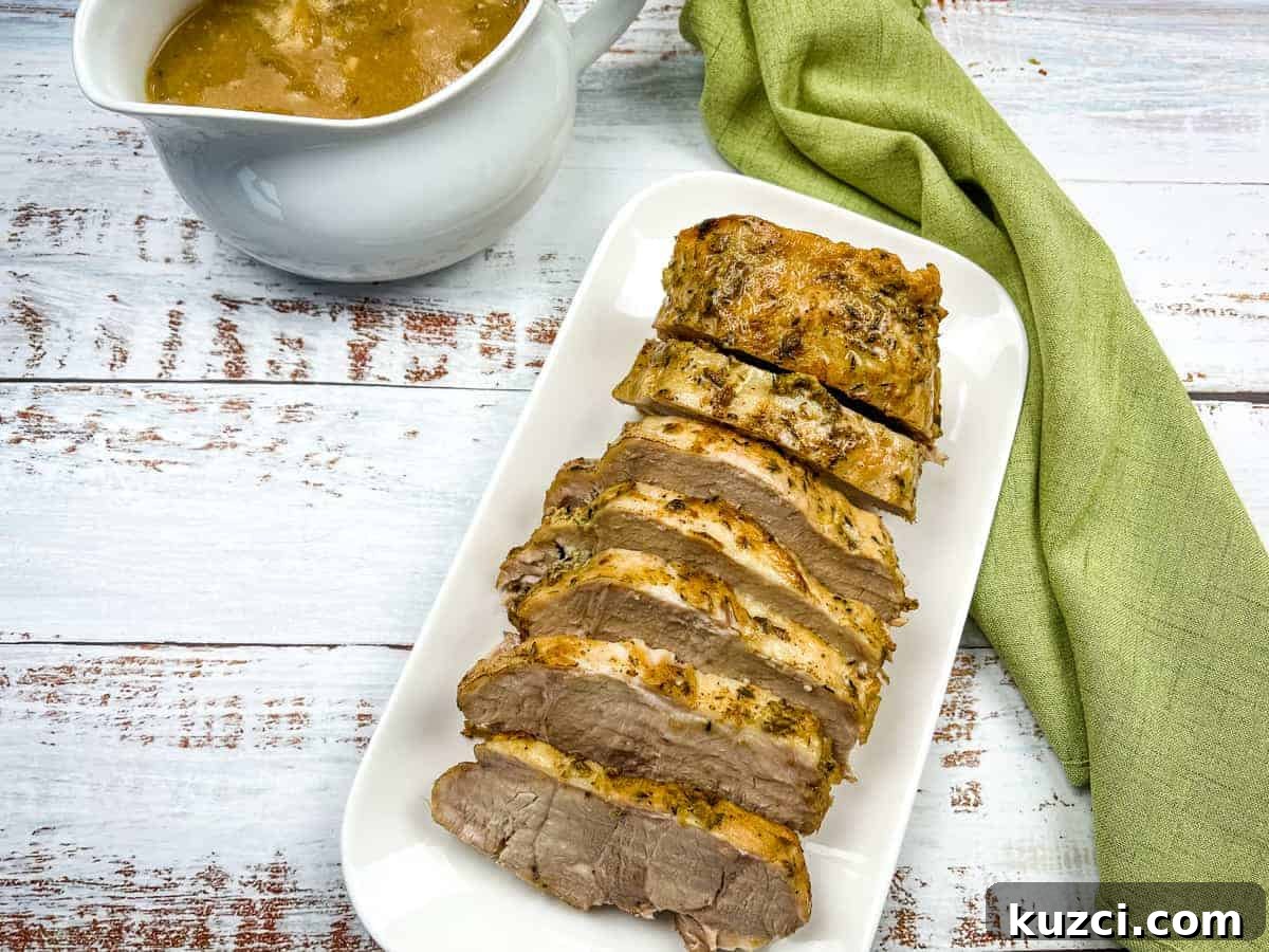 33 Fall Dinner Recipes Packed With Comfort Food Favorites 17 German Pork Loin on a platter with a gravy boat nearby.