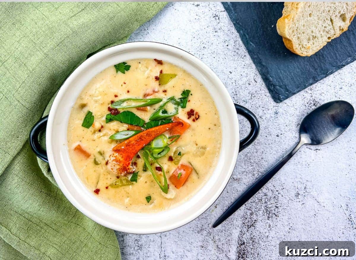 33 Fall Dinner Recipes Packed With Comfort Food Favorites 19 A bowl of lobster chowder with bread on the side.