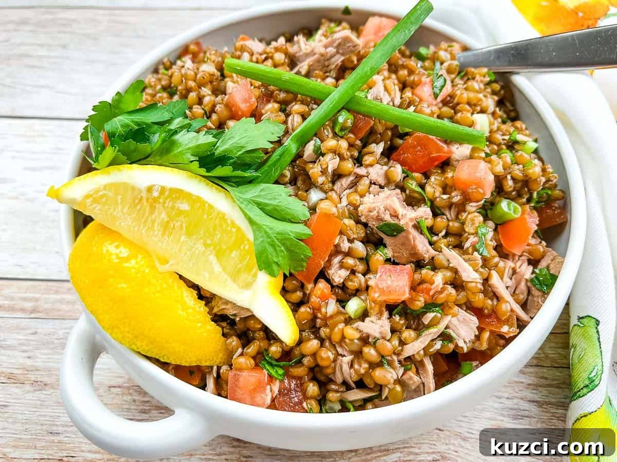 33 Fall Dinner Recipes Packed With Comfort Food Favorites 23 Wheat Berry Salad with Tomato & Tuna in a bowl.