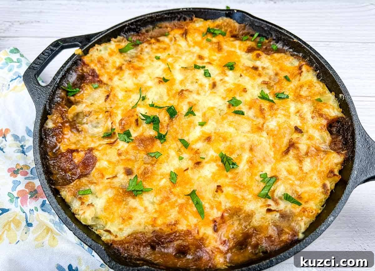 33 Fall Dinner Recipes Packed With Comfort Food Favorites 29 Leftover Roast Beef Shepherd's Pie in a cast iron dish.