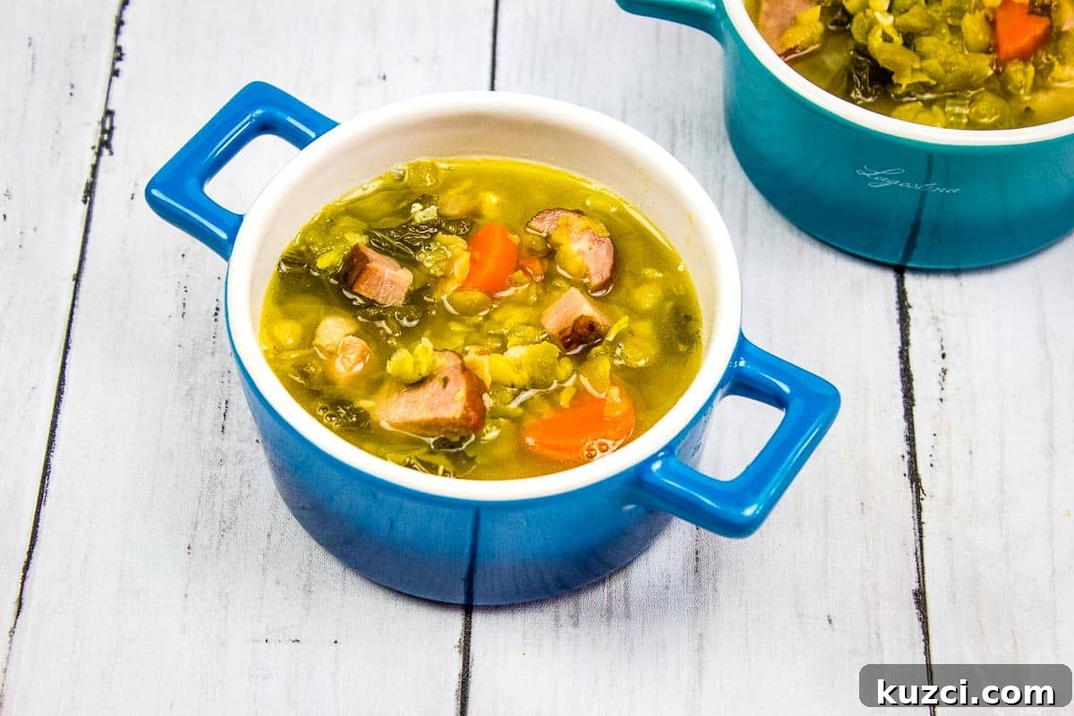 33 Fall Dinner Recipes Packed With Comfort Food Favorites 32 Two bowls of soup with ham, sausage, split peas and vegetables in them.