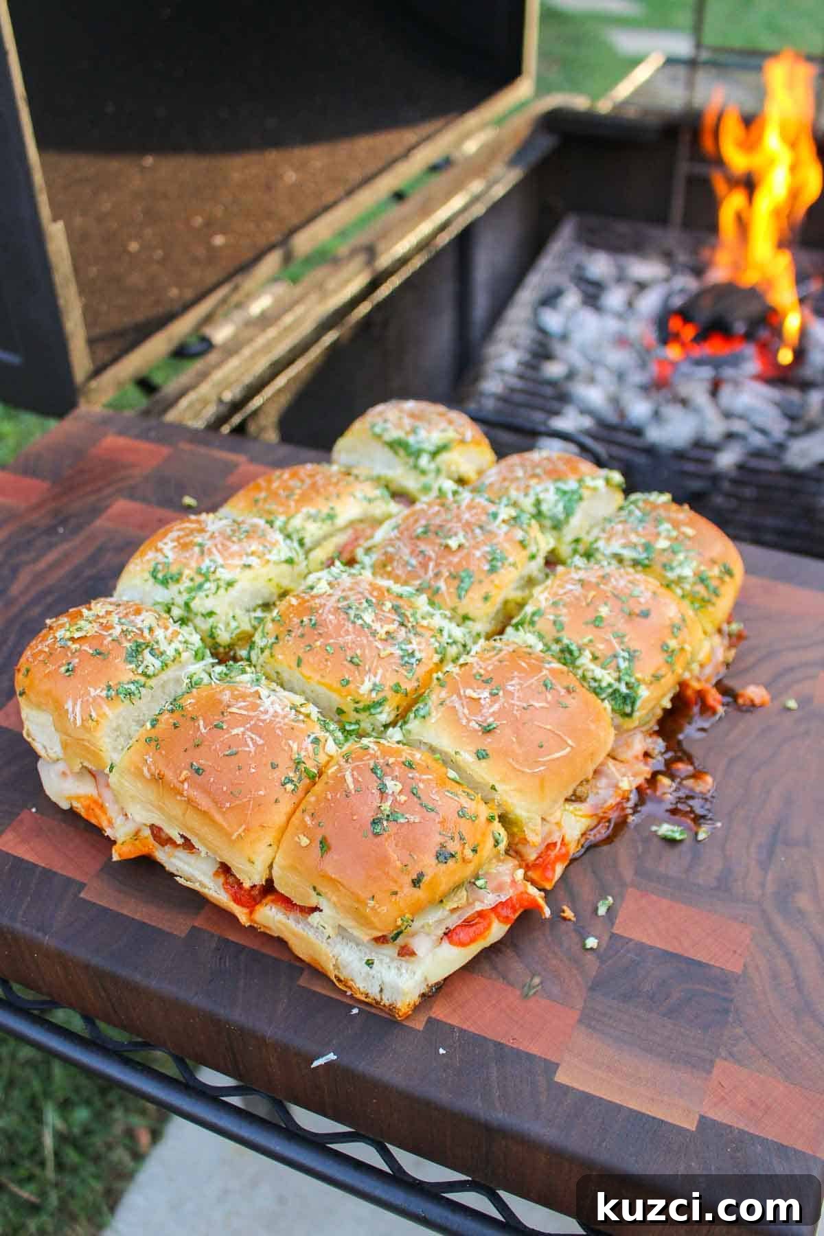 Italian Sliders with Hawaiian Rolls 9 The finished Italian sliders sitting on a cutting board.