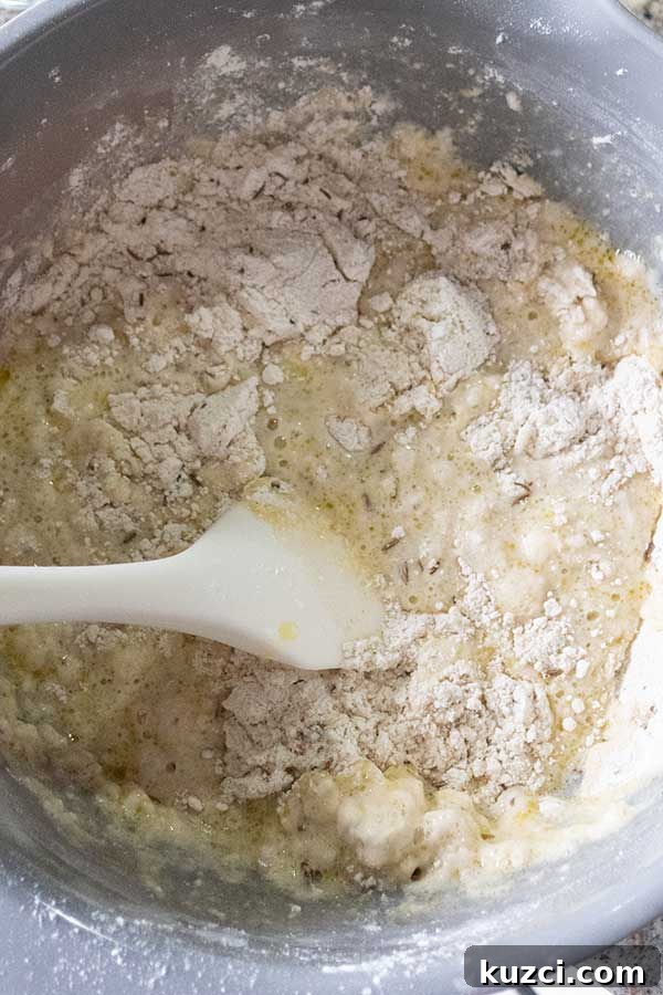 mixing gluten free flour with water in a bowl