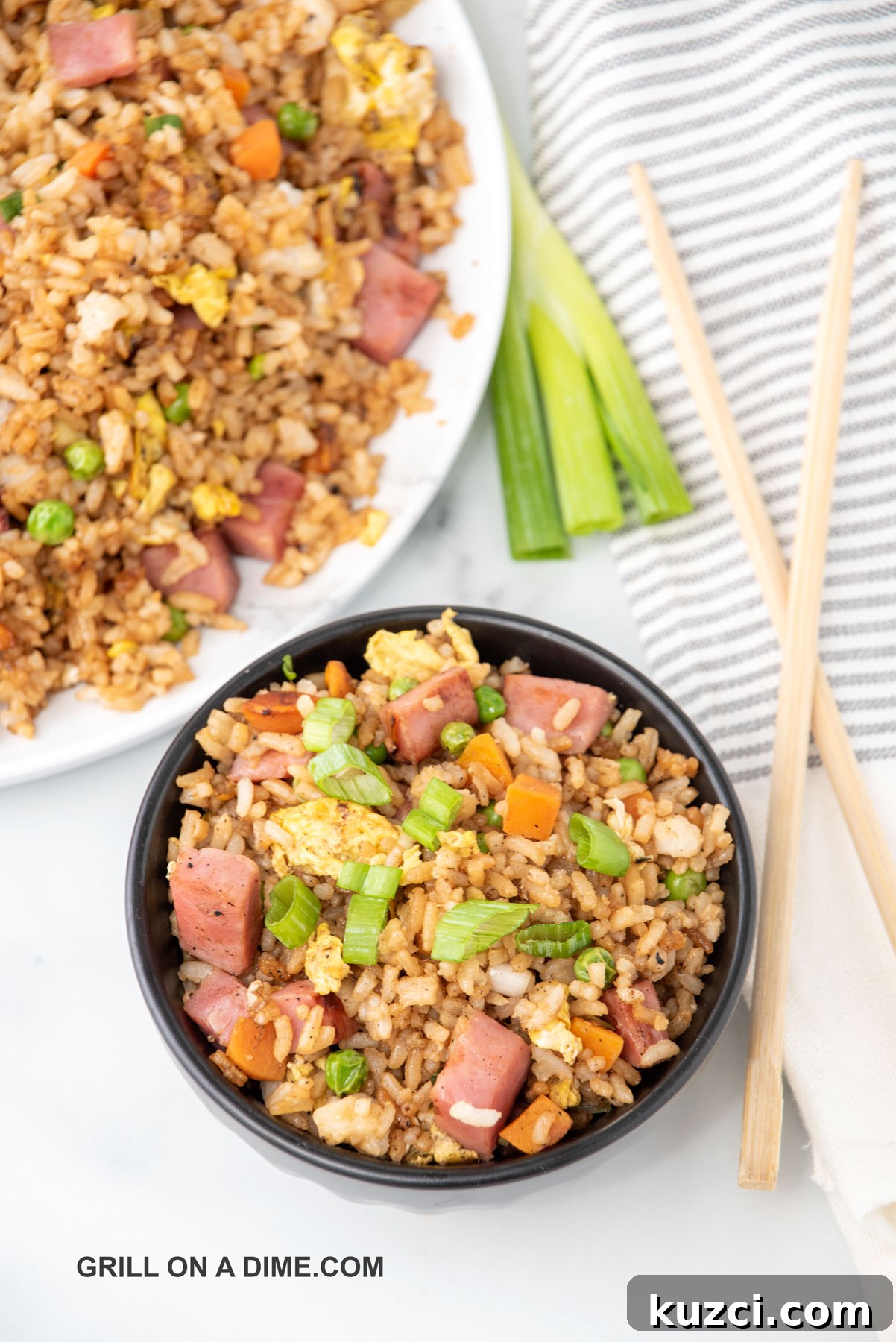 Savory Ham Fried Rice with Eggs and Vegetables 10 Close up image of ham fried rice in a black bowl
