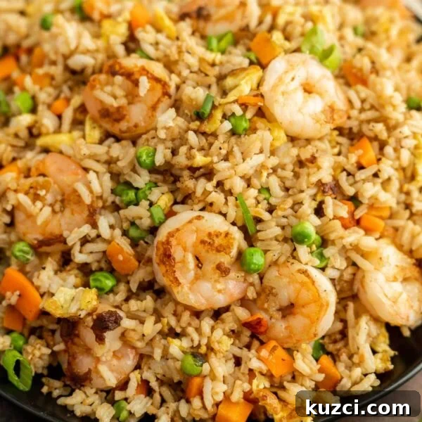 Savory Ham Fried Rice with Eggs and Vegetables 11 Shrimp Fried Rice in a bowl.