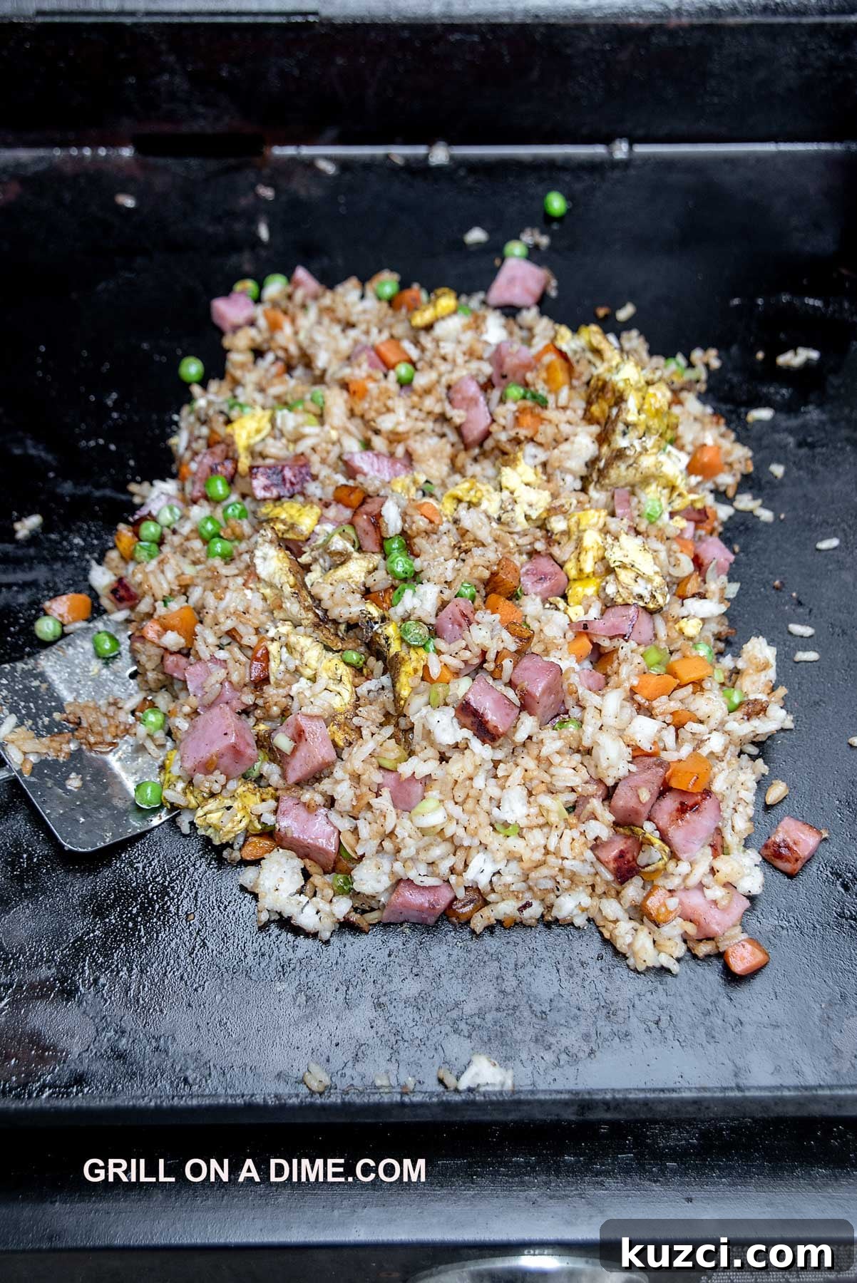 Savory Ham Fried Rice with Eggs and Vegetables 7 Cooking the ham fried rice on the griddle