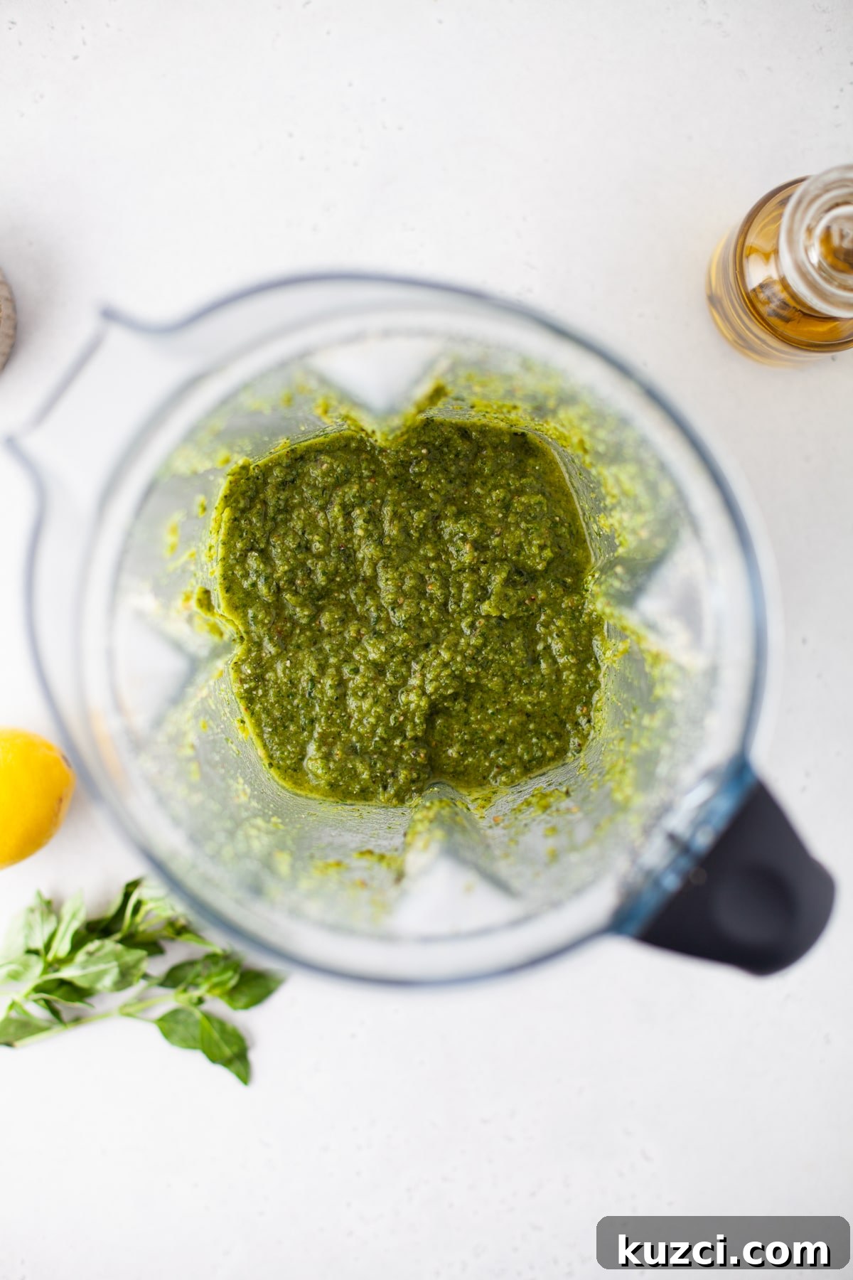 Trader Joe's Copycat Black Truffle Cashew Pesto Recipe 6 An overhead image of pureed cashew pesto inside of a blender.