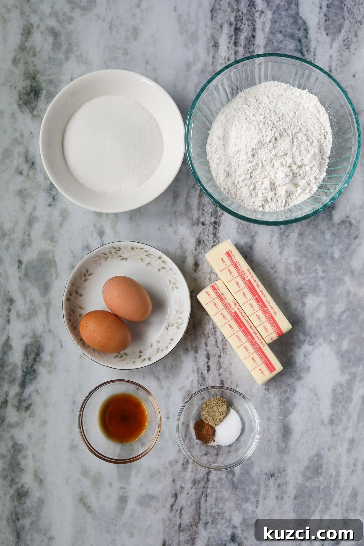 Cardamom Butter Cookies Recipe 3 Ingredients for making cardamom butter cookies arranged on a marble table.