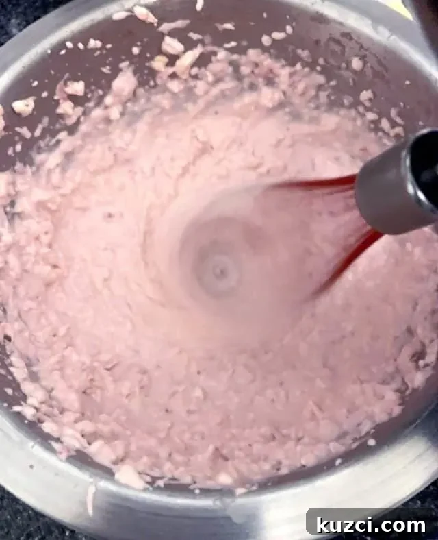 Keto Strawberry Cheesecake Fat Bombs Recipe 4 mixing strawberry cheesecake fat bomb