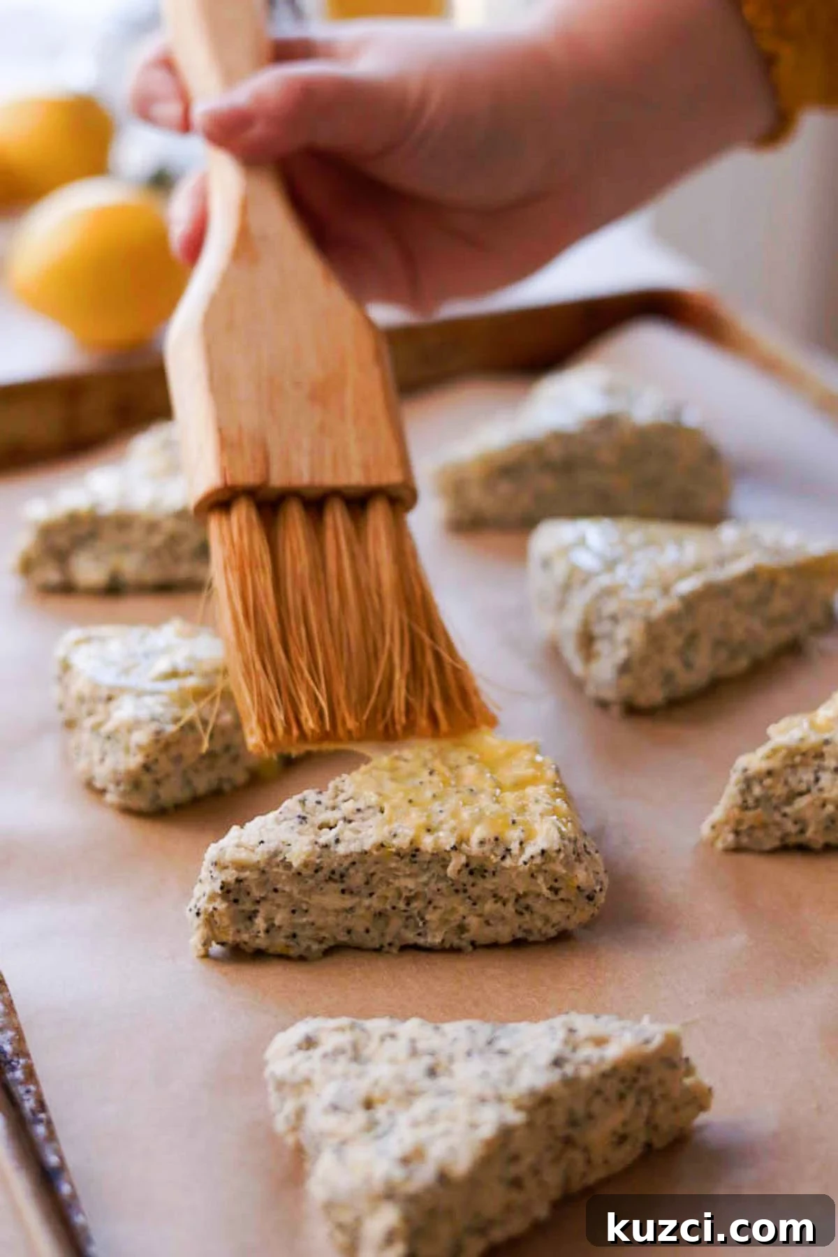 Lemon Poppy Seed Scones with Zesty Glaze 11 brushing scones with egg wash using pastry brush