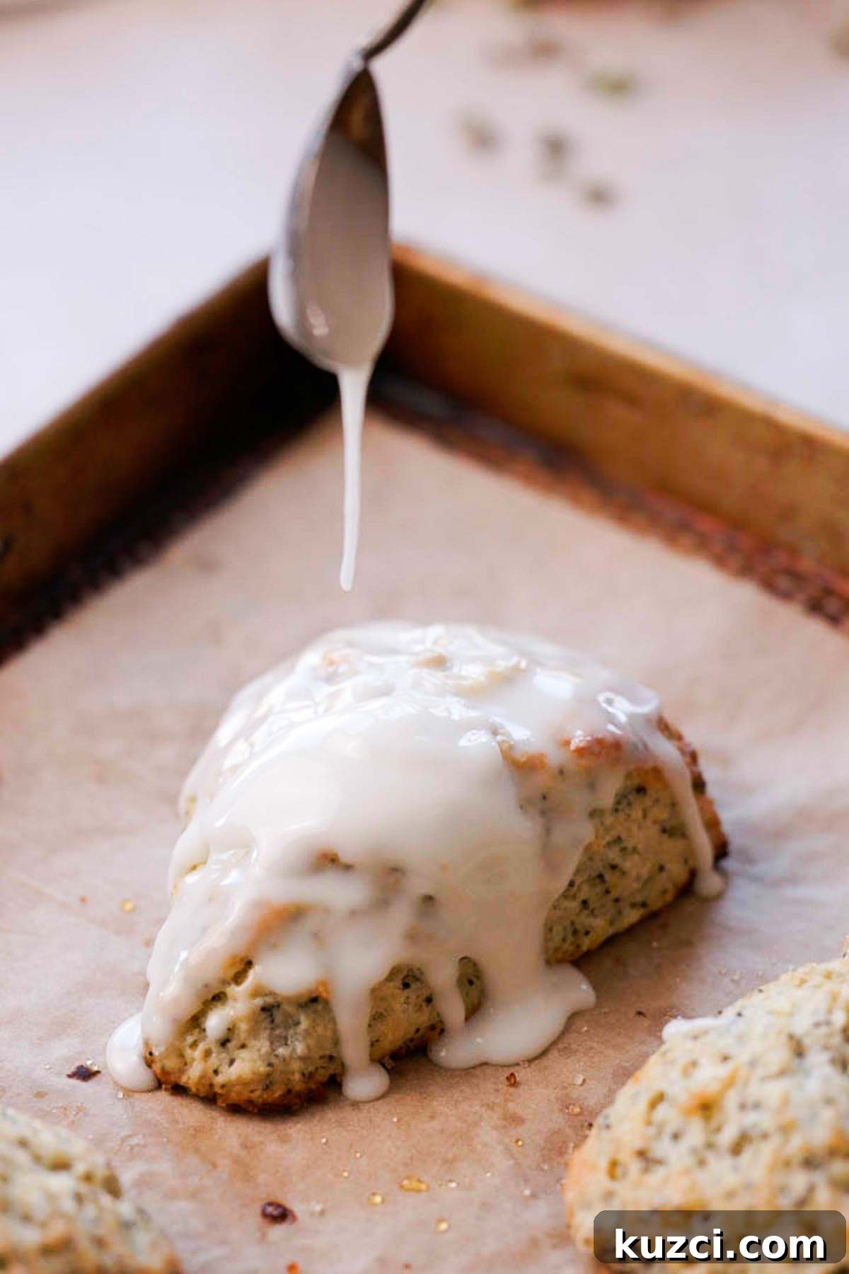 Lemon Poppy Seed Scones with Zesty Glaze 12 drizzling lemon glaze on baked lemon poppy seed scones