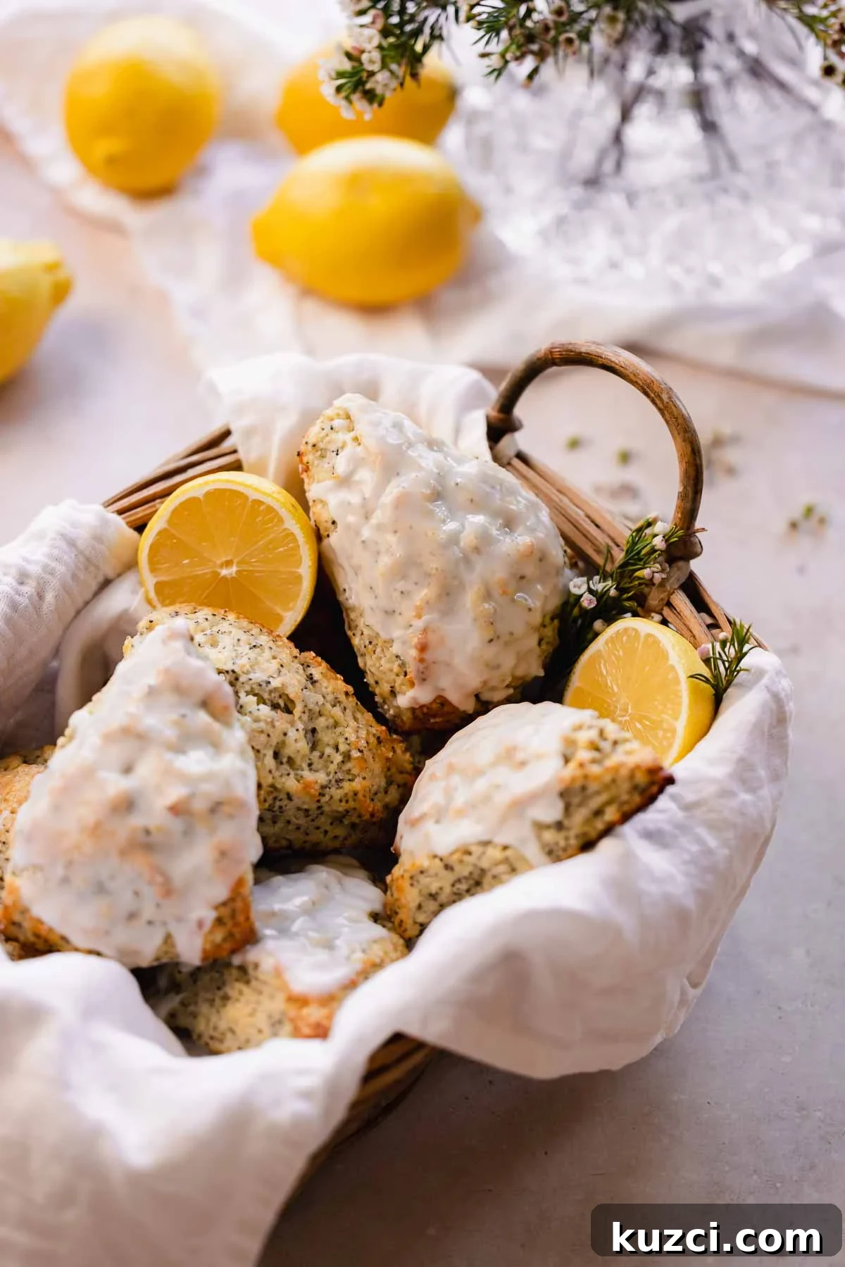 Lemon Poppy Seed Scones with Zesty Glaze 13 lemon poppy seed scones in basket lined with towels