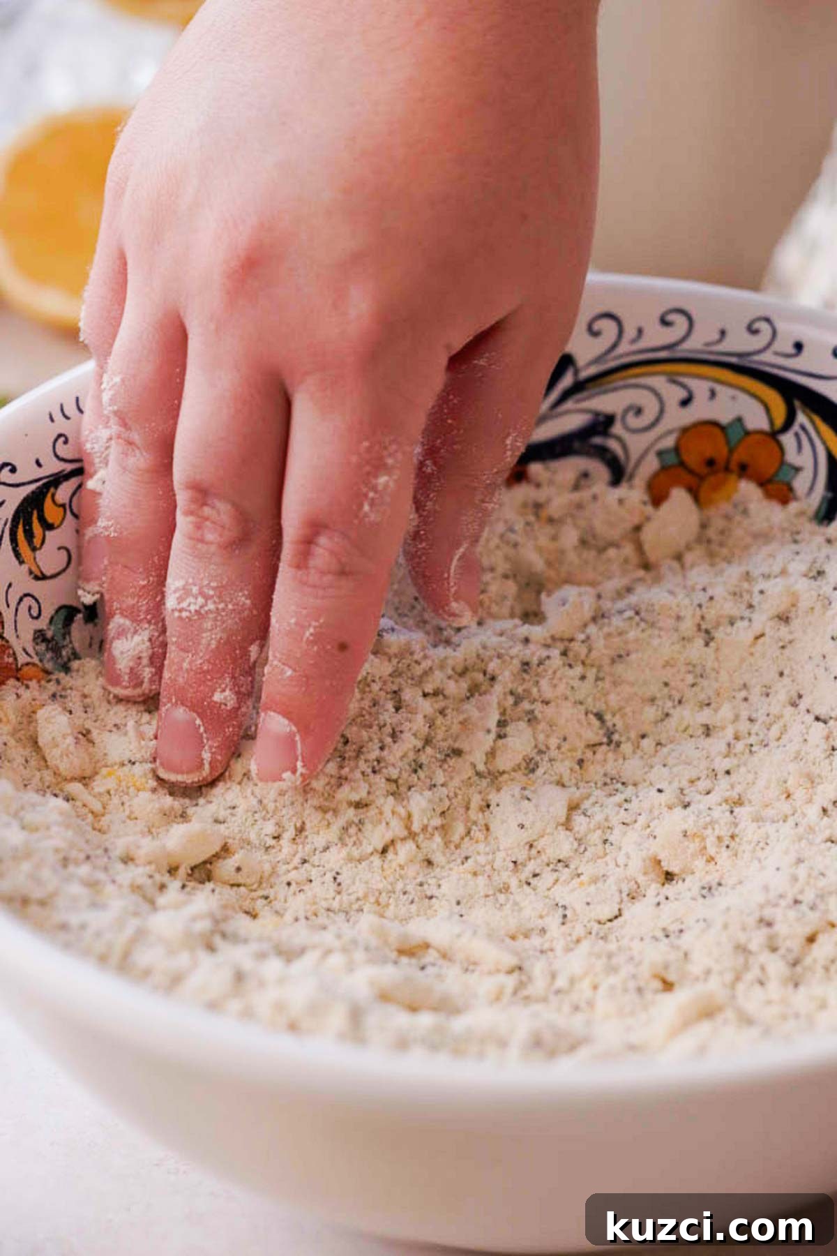 Lemon Poppy Seed Scones with Zesty Glaze 6 rubbing butter into the flour mixture for poppy seed scone dough