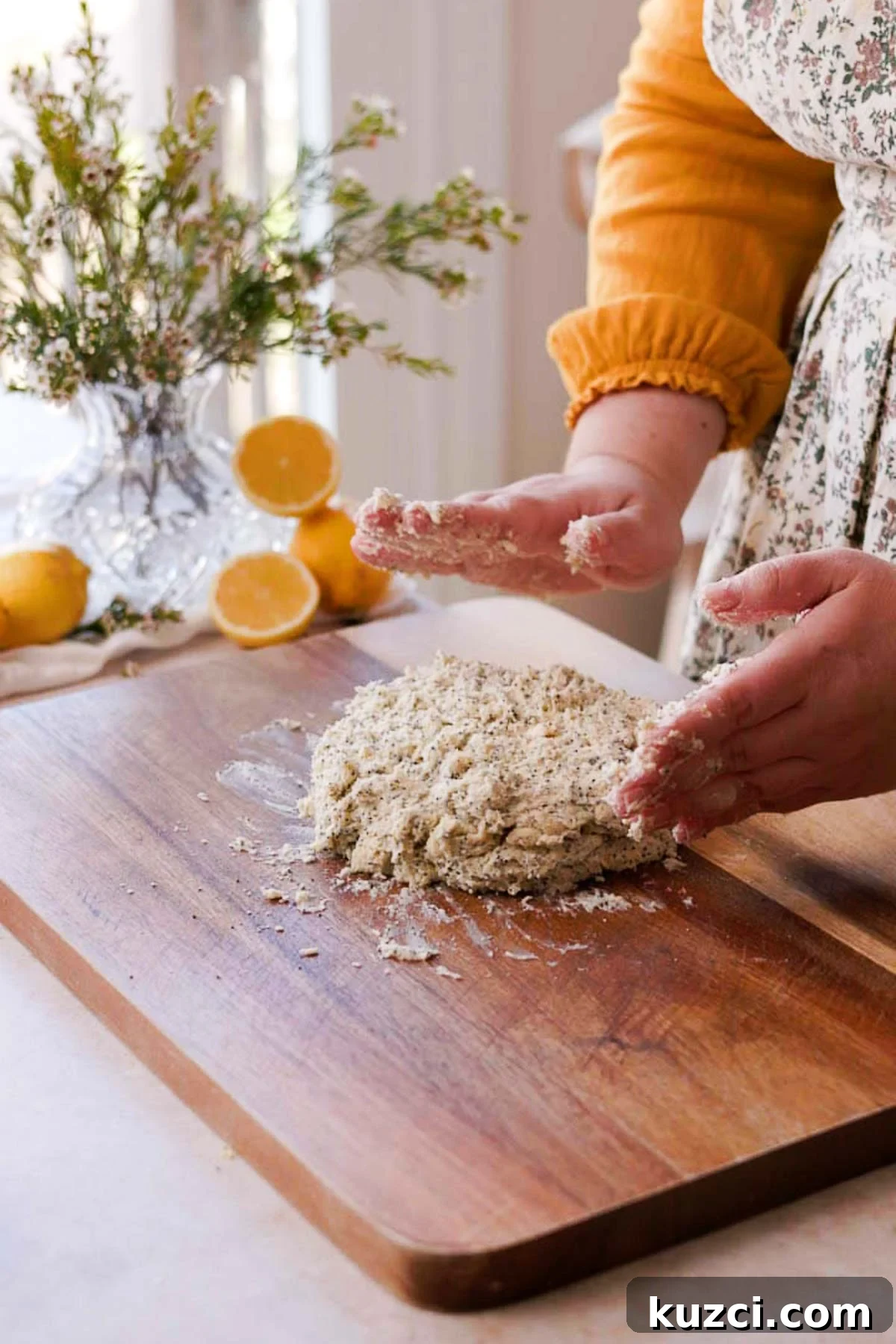 Lemon Poppy Seed Scones with Zesty Glaze 8 bringing together the scone dough into a round shape