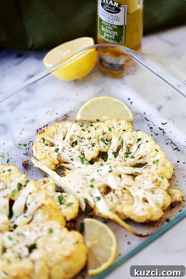 Make crispy roasted cauliflower tossed in olive oil and seasoned with lemon zest, paprika, and thyme. An easy, flavorful vegetable side dish! Roasted cauliflower seasoned with lemon, paprika, and thyme on a baking sheet.