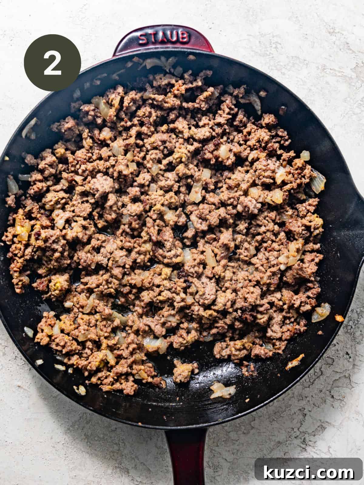 ground beef, onions, and seasonings in a skillet.