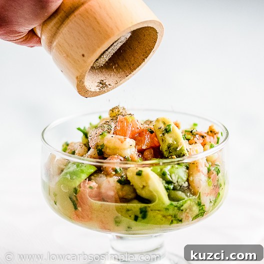 Dairy Free Shrimp Avocado Red Grapefruit Salad 10 Shrimp Avocado and Red Grapefruit Appetizer; Grounding the Black Pepper on Top | Low-Carb, So Simple