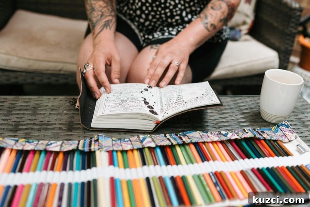 woman with a journal and lots of colored pencils