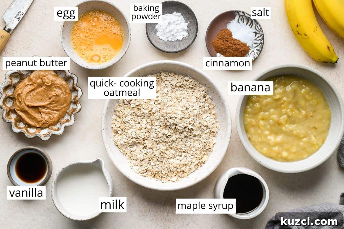 Peanut Butter Banana Baked Oatmeal Recipe 2 overhead photo of the ingredients in this Peanut Butter Banana Baked Oatmeal recipe all in bowls and labeled like mashed banana, quick-cooking oatmeal, peanut butter, egg, and more