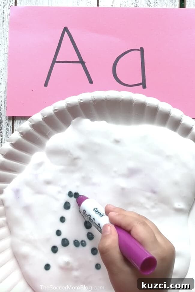 Letter recognition activity using slime for hands-on preschool learning.