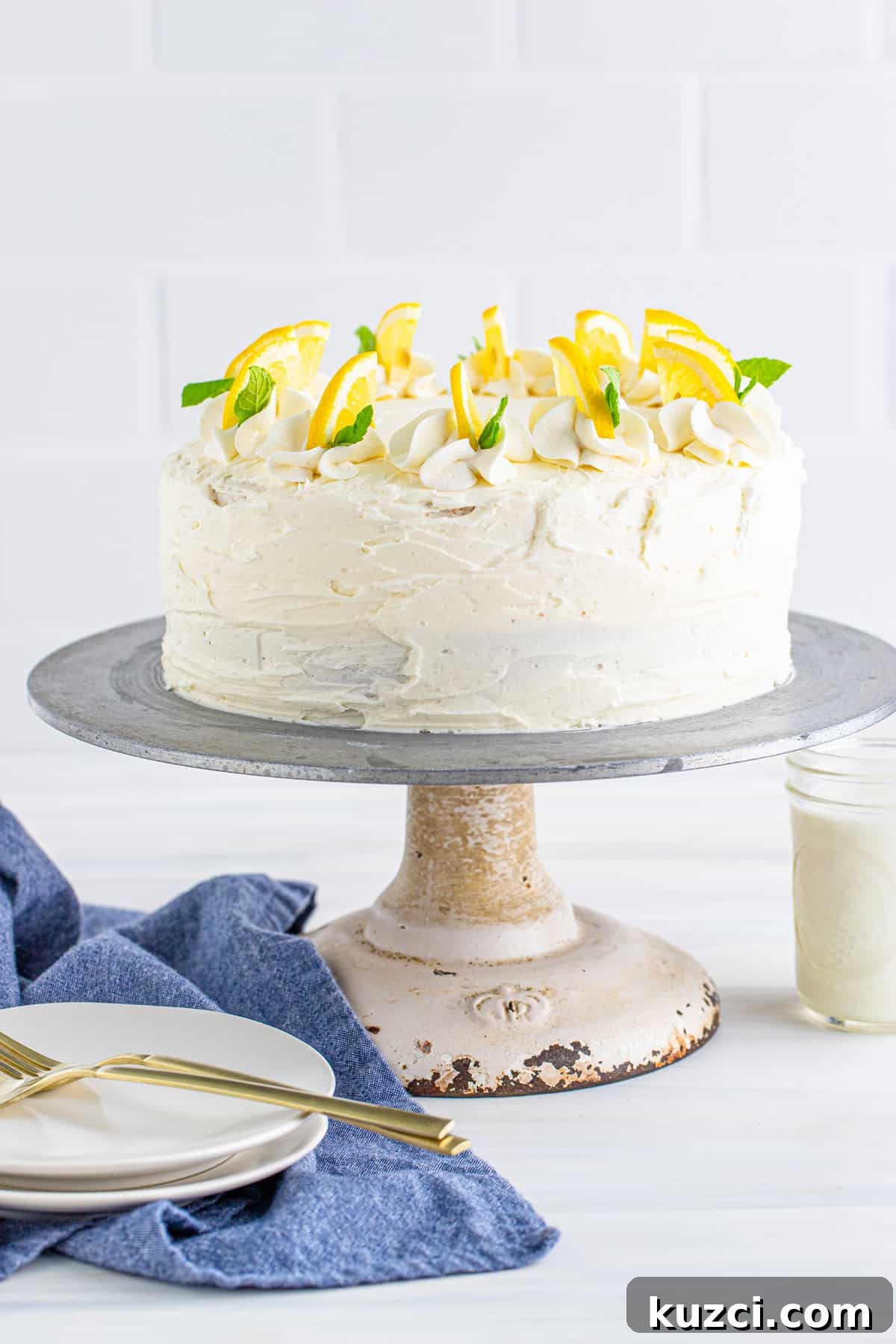 Zesty Lemon Layer Cake with Silky Buttercream 3 Finished cake decorated on cake stand