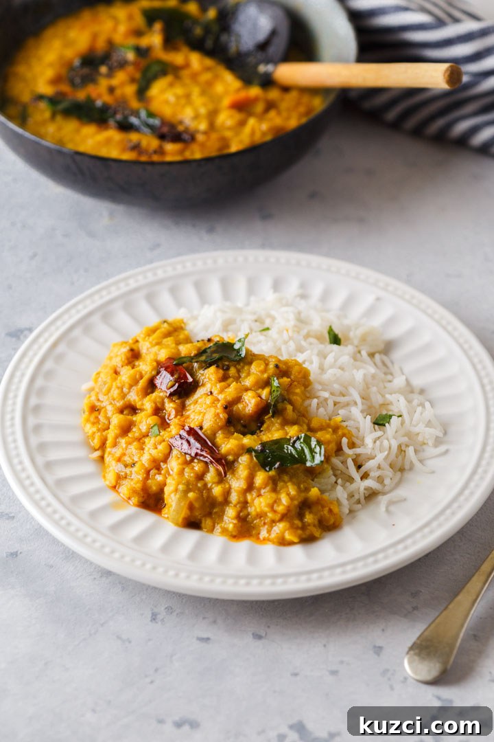 Sri Lankan Red Lentil Dal Recipe 4 Red lentil dal on a plate with rice
