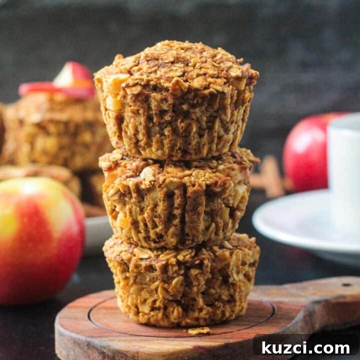Three baked oat cups in a stack.